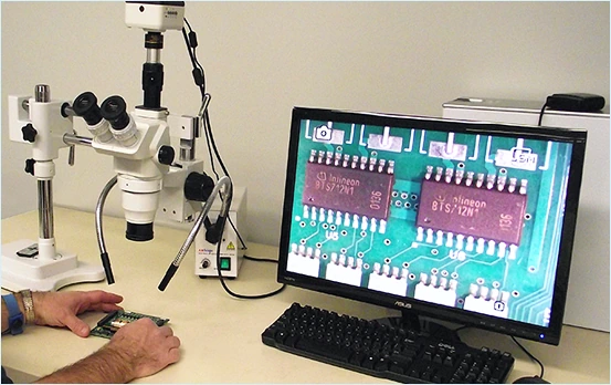 Component inspection under a microscope at Jingteng Electronics