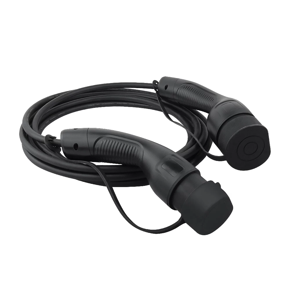 Coiled Type 2 to Type 2 EV charging cable with plugs covered by dust caps.